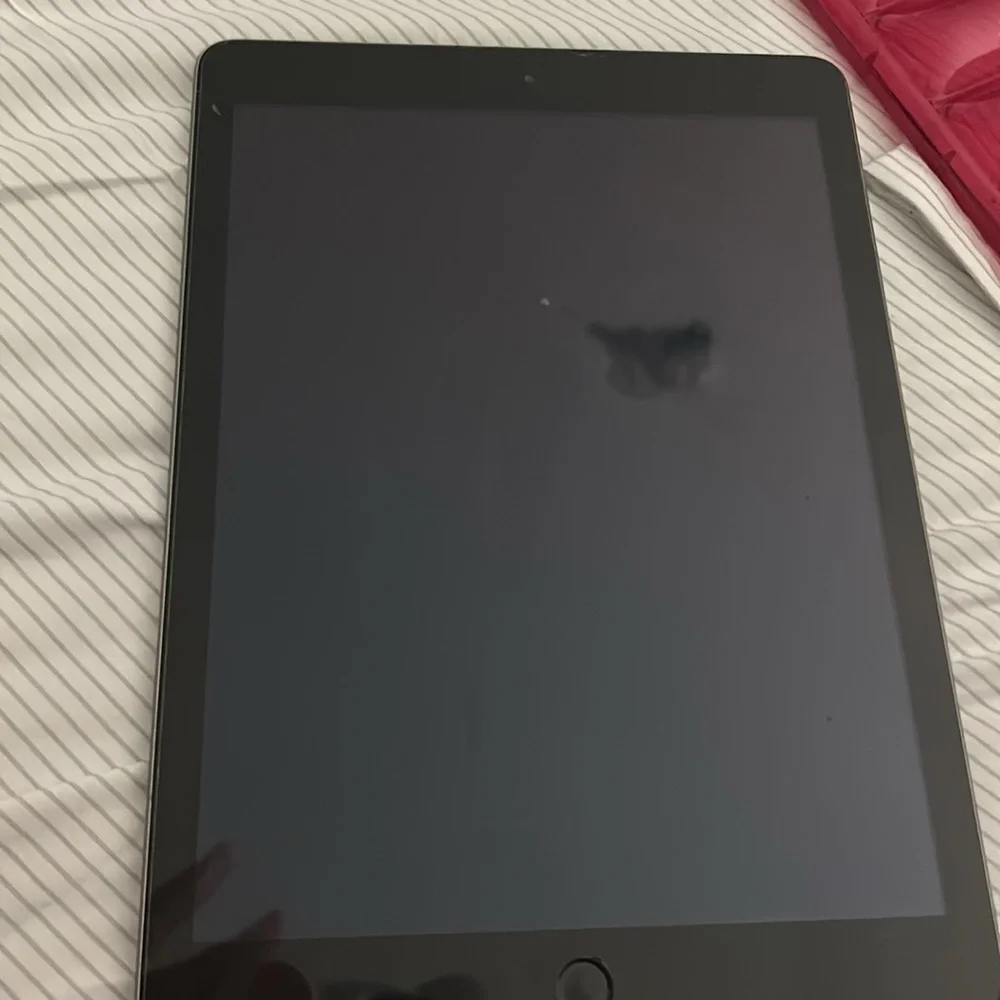 ipad 5th generation wifi but can be added to service slightly cracked screen